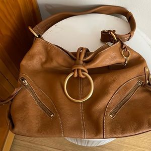 Large leather handbag with gold hardware